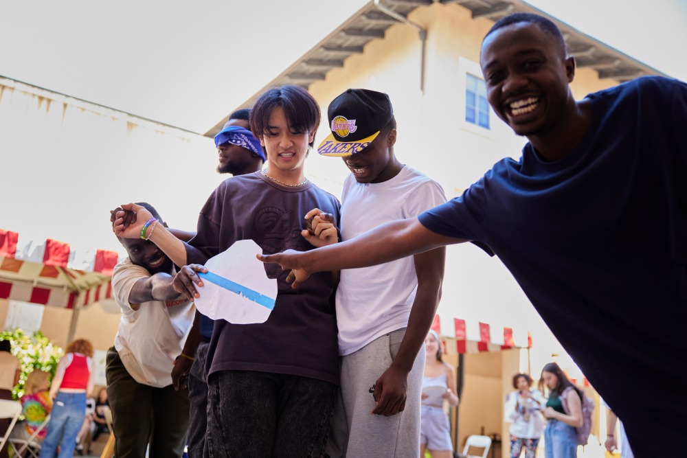 Four students smile as they take part in DEI Orientation Day activities