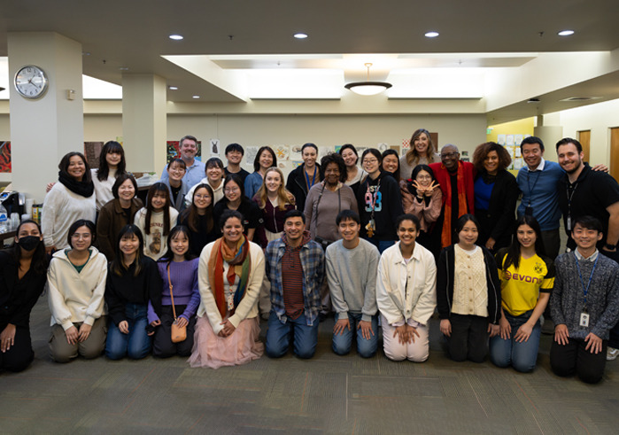Attendees of a community dialogue for MLK Week pose for a group photo.
