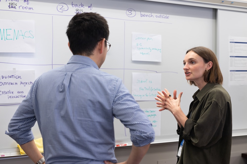 A student converses with Tetsushi Ogata ’05, visiting assistant professor of peace and conflict studies and managing director of the Soka Institute for Global Solutions, during a session on June 11.