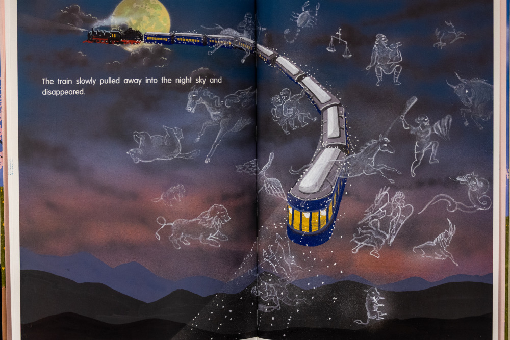 Two-page spread from a children's book depicting a train flying through the sky with ancestors and animals in white outlines floating alongside it.