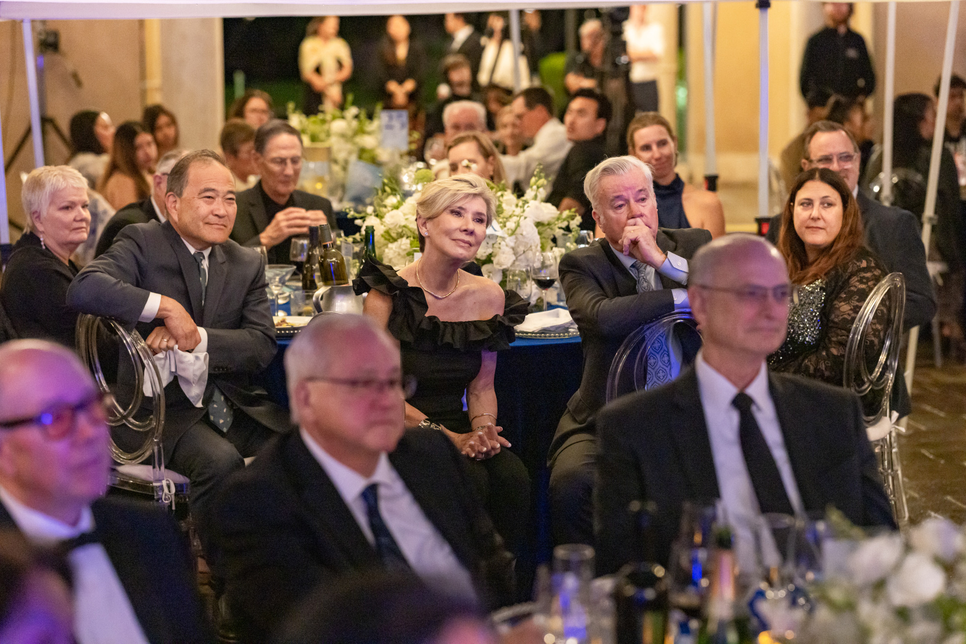 Gala attendees wearing formal attire listen intently during the 2026 Peace Gala on Soka's campus.