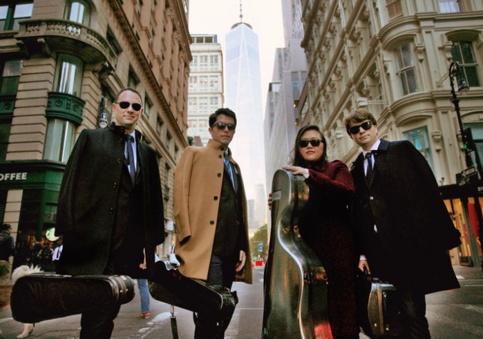Calidore String Quartet members standing in New York City