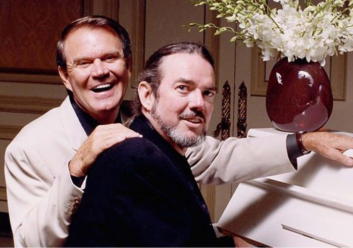 Glen Campbell and Jimmy Webb sitting at piano