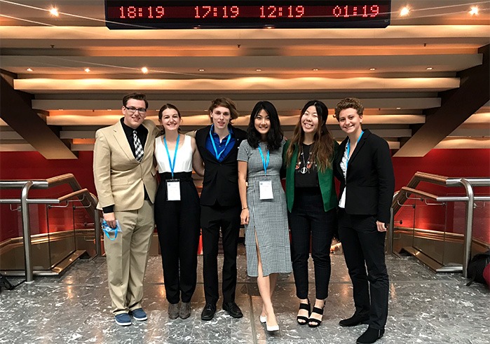 Soka's Model UN team posing at the airport