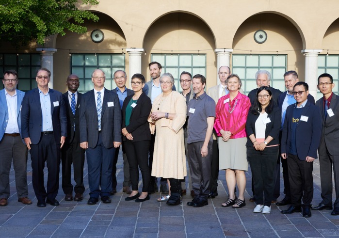 Educational leaders representing six of the nine members of the Pacific Alliance of Liberal Arts College pose in front of the Athenaeum