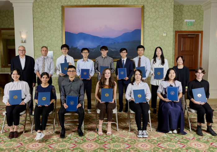 Recipients of Soka University of America’s top academic honors pose for a photo with their awards.
