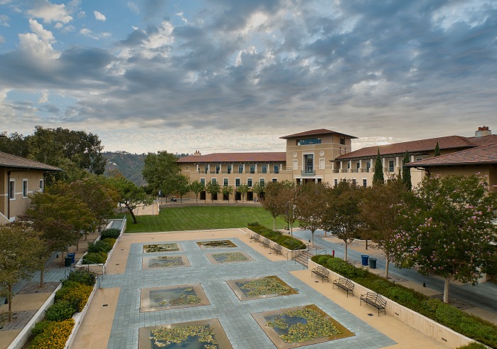 Aerial view of campus lily ponds with academic buildings in the background