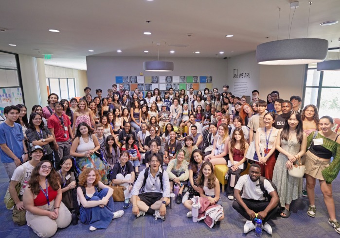 The Class of 2028 poses for a group photo after arriving for orientation