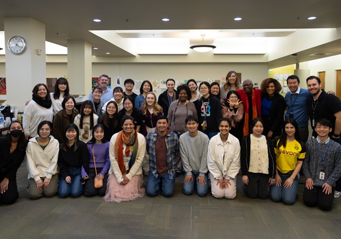 Attendees of a community dialogue for MLK Week pose for a group photo.