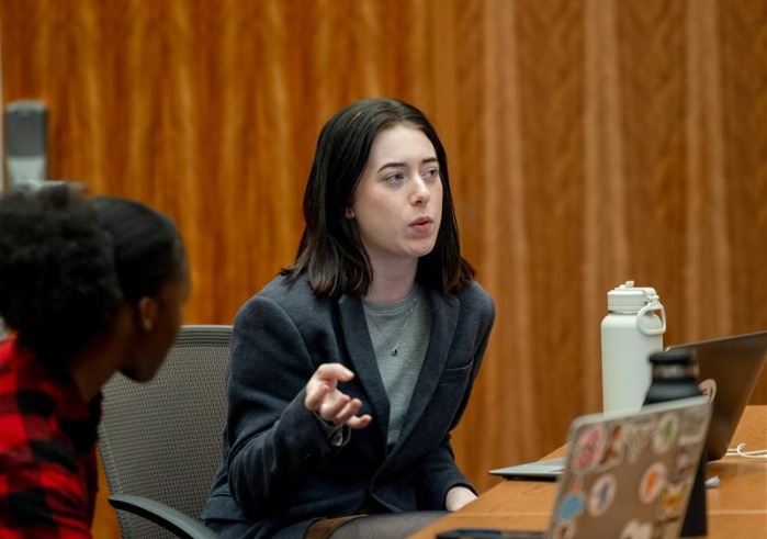 Carol Krein Robinson '25 speaks to fellow students during class at SUA.