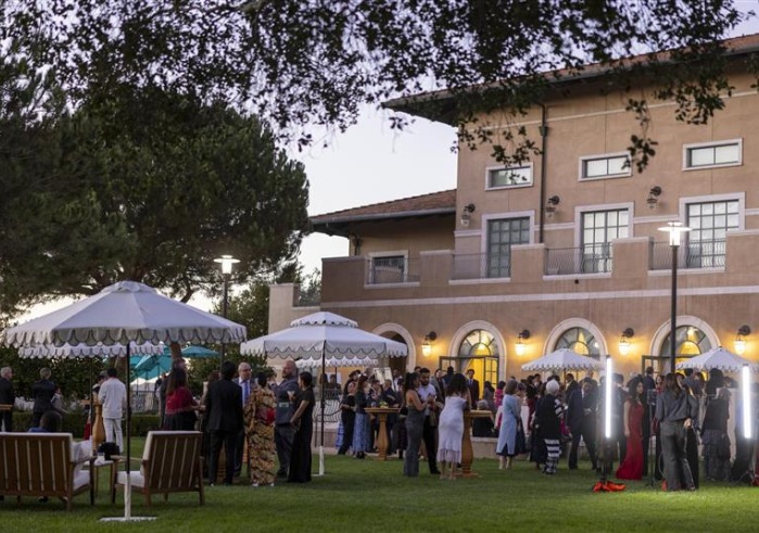 Gala attendees mingle in the Athenaeum courtyard during the 21st annual Peace Gala