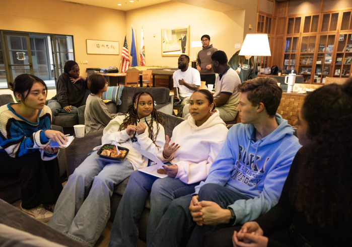 Students sit on a couch and discuss “Citizen King,” a documentary examining the final years of Dr. King’s life