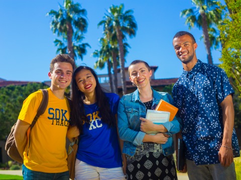 Image of a group of students smiling.