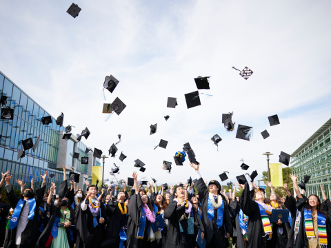 2022 Soka graduates toss their caps in the air