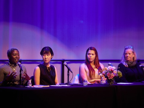 Anne Pearce, director of the creative arts program, Soka alumnus Giselle Velasquez ’15, Nappa Kataoka ’23, and Wilnie Merilien, resident hall coordinator sit on stage and speak during the “Voices of Women at Soka” event.
