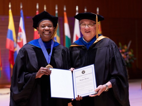 Wanjira Mathai smiles with President Feasel as she accepts the Soka Global Citizen Award