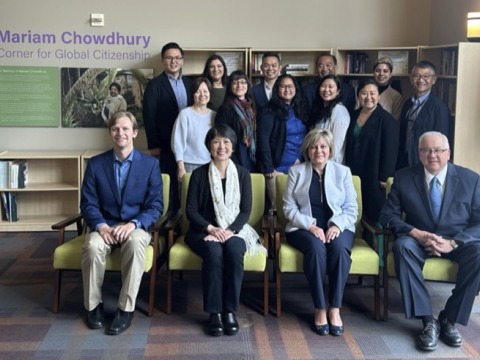 Soka staff members and alumni pose in the new Mariam Chowdhury Corner for Global Citizenship area of Soka University.