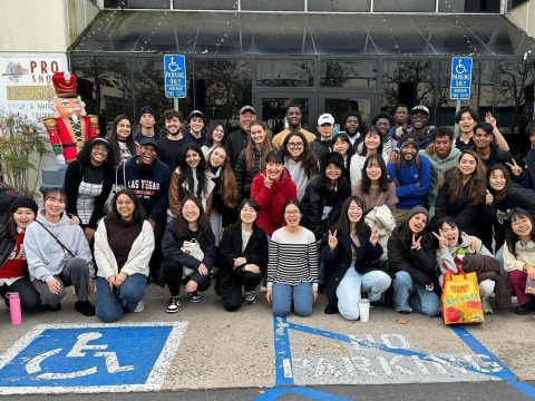 Councilman Ross Chun poses with a large group of students in front of the Aliso Viejo Ice Palace.
