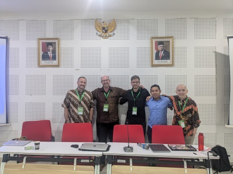 Shane Barter poses with scholars during the Association for Asian Studies in Asia annual conference 