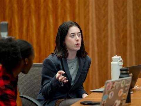 Carol Krein Robinson '25 speaks to fellow students during class at SUA.