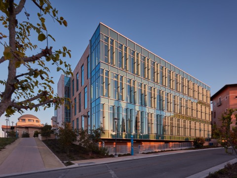 Sunlight reflects off Curie Hall on SUA's campus.