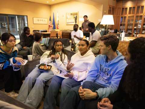 Students sit on a couch and discuss “Citizen King,” a documentary examining the final years of Dr. King’s life