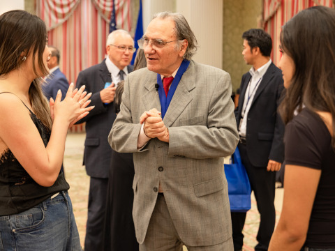 Carlos Alberto Torres talks with students after the award ceremony.