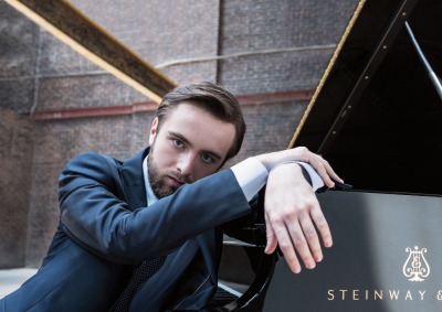 Daniil Trifonov sitting at piano