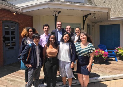 Image of a professor with students.