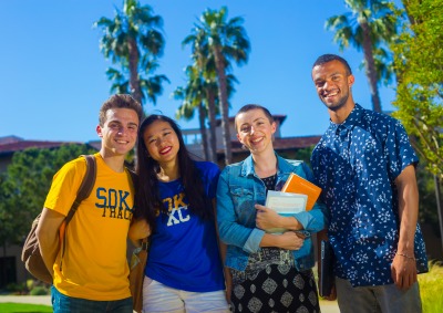 Image of a group of students smiling.