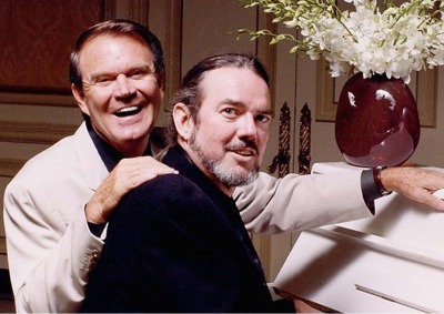 Glen Campbell and Jimmy Webb sitting at piano