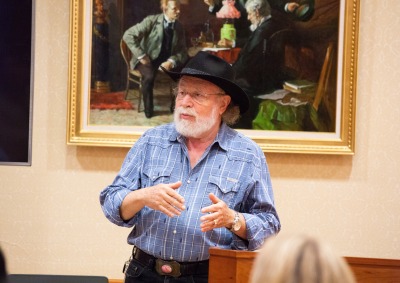 Image of Arie Galles speaking at an event.
