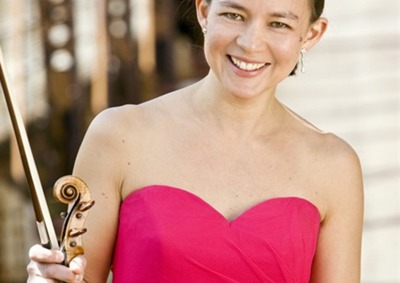 Elissa Lee Koljonen wearing a pink dress holding a violin