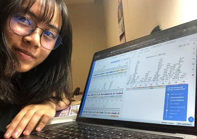 Student displays research on laptop