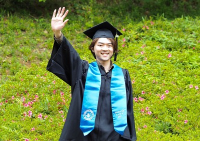 Shunji Fueki in cap and gown