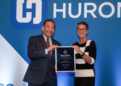 Arch Asawa and Susan Scroggins pose with an award