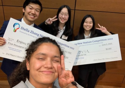 Qiankuan Yang ’23, Yixin Wang ’23, UCI student Qian "Rebecca" Liu, and Aarohee Bhattarai ’23 pose with giant checks at the UCI New Venture Competition.