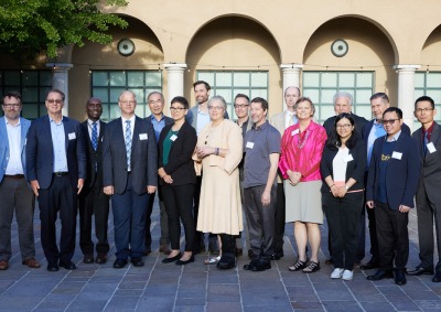 Educational leaders representing six of the nine members of the Pacific Alliance of Liberal Arts College pose in front of the Athenaeum