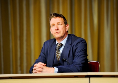 Dr. Asle Toje, deputy leader of the Norwegian Nobel Committee, wears a blue suit and looks off into the distance