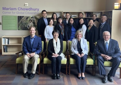 Soka staff members and alumni pose in the new Mariam Chowdhury Corner for Global Citizenship area of Soka University.