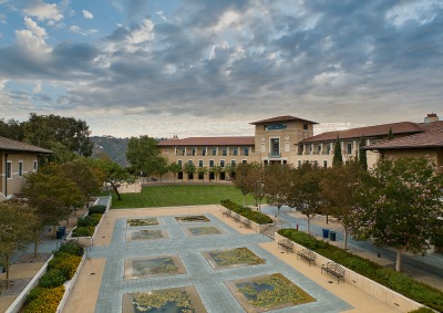 Aerial view of campus lily ponds with academic buildings in the background