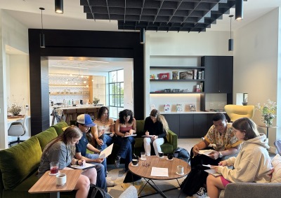 A large group of students sit together in the Global Language and Culture Center