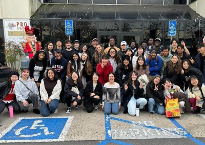 Councilman Ross Chun poses with a large group of students in front of the Aliso Viejo Ice Palace.