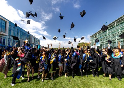 2024 SUA Graduates toss their caps in the air in celebration of commencement