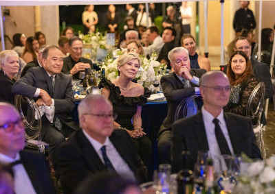 Gala attendees wearing formal attire listen intently during the 2026 Peace Gala on Soka's campus.