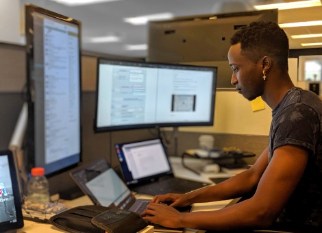 Man at his computer workstation