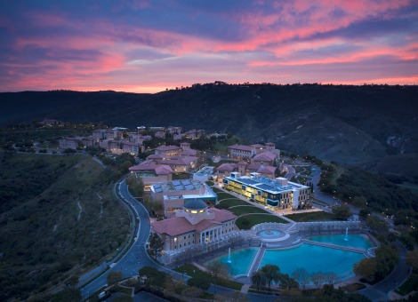 Aerial Drone image of Soka University of America's campus during sunset with a pink and purple sky