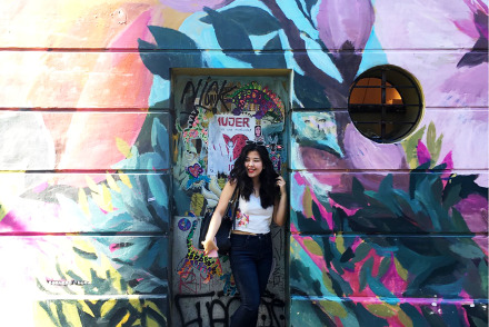 Student in front of graffiti in Buenos Aires