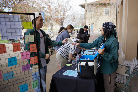 SUA students interact during a tabling event on SUA's campus