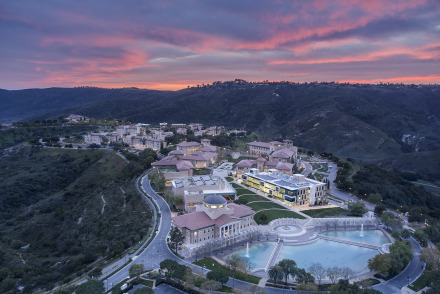 Aerial shot of campus during sunset with the sky burning pink and blue